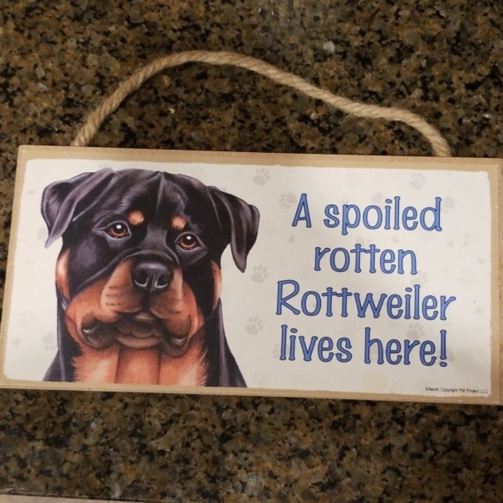 Spoiled Rottweiler lives here sign